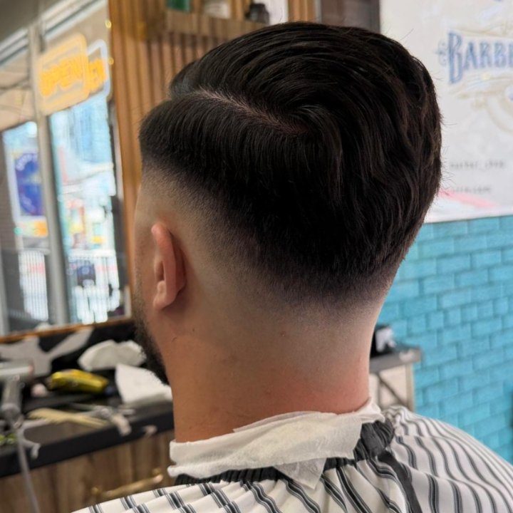 Back view of textured cut and skin fade at Nasim Barbershop