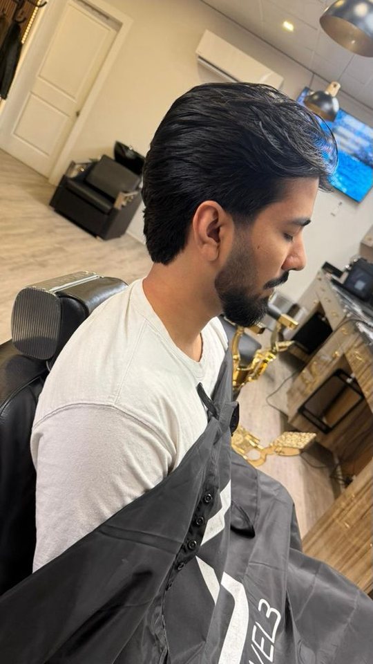 Clean haircut and beard styling at Nasim Barbershop