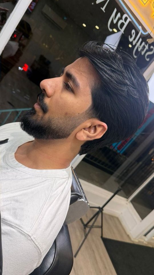 Profile view of beard styling at Nasim Barbershop