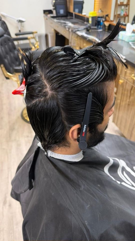 Long hair restyle preparation at Nasim Barbershop