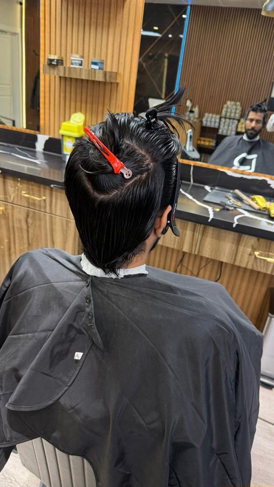 Hair restyle in progress at Nasim Barbershop